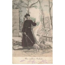 COCHONS -MK44999 UNE FEMME EN ROBE NOIR ET DEUX PORCELETS